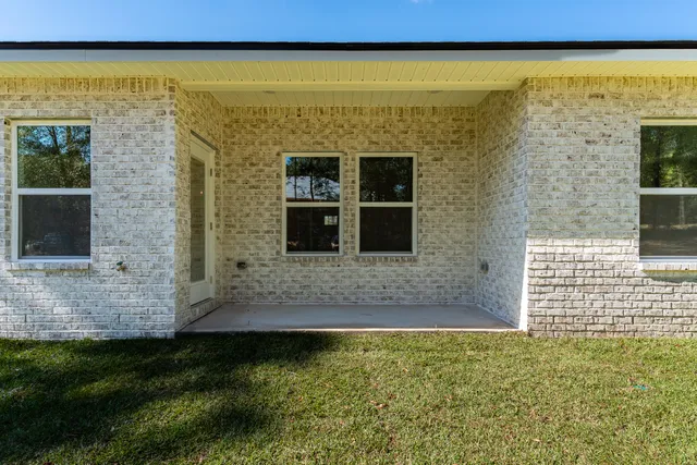 a view of front door of house with outdoor space