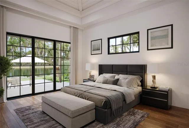 a bedroom with a bed and a large window