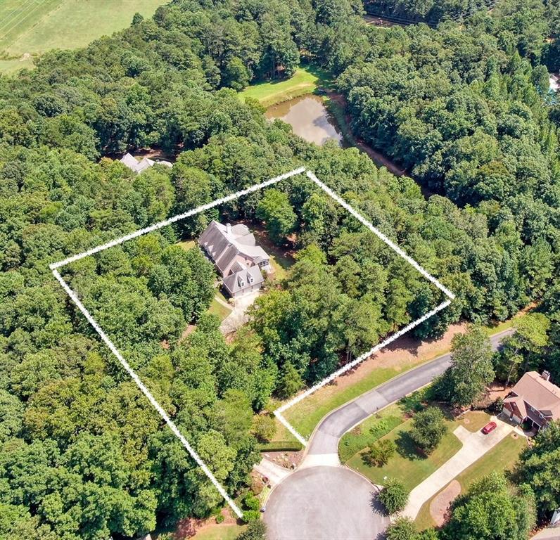 Enjoy your own 1.89 acre private oasis without missing out on the conveniences of Milton / Alpharetta