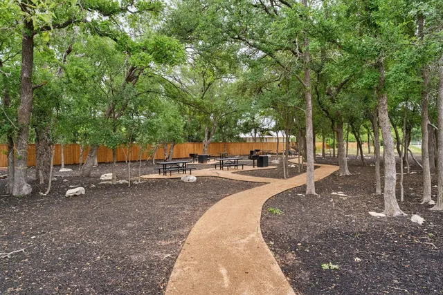 a view of a backyard with sitting area
