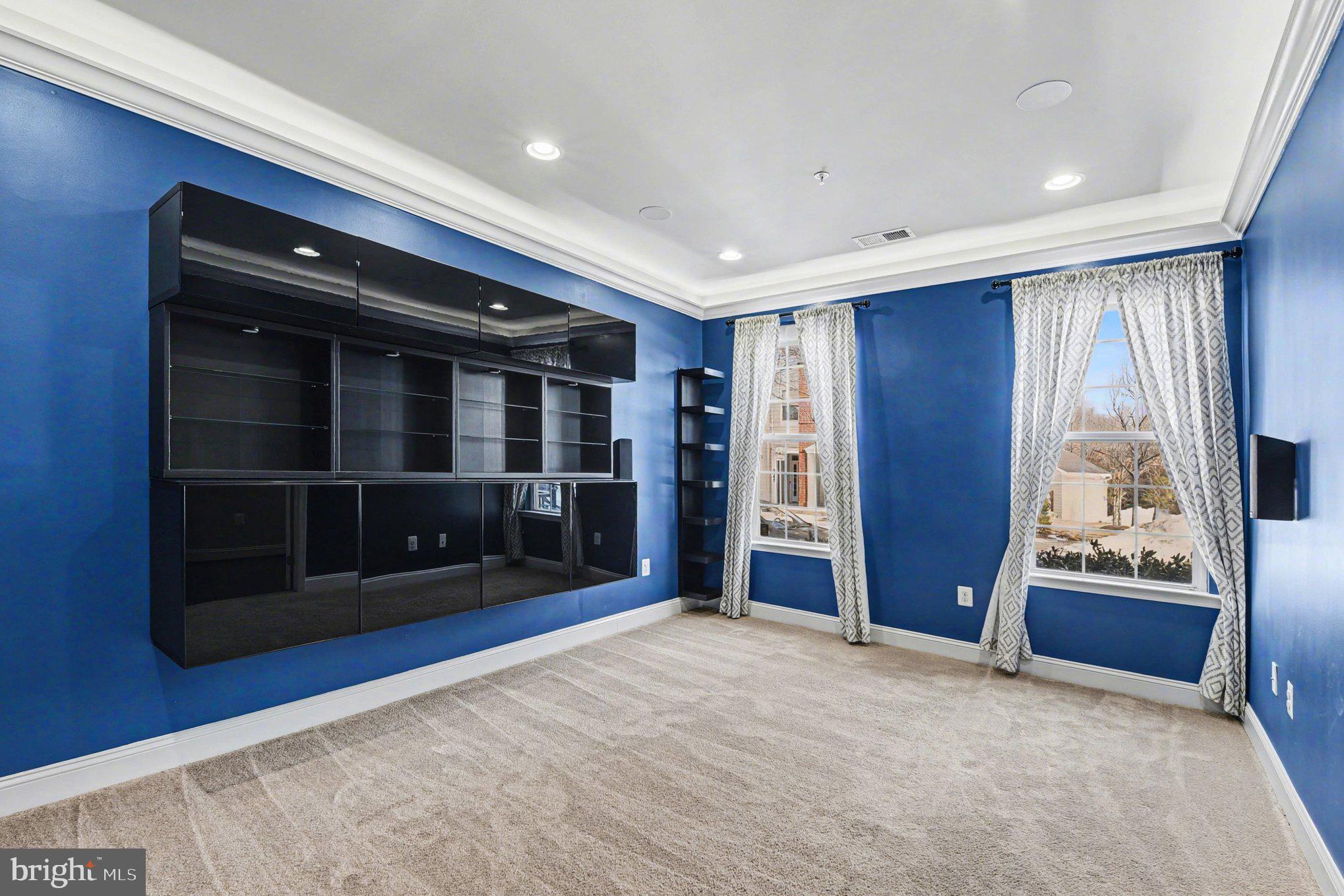 5954 Logans Way Ellicott City, MD 21043 - Photo 33 of 46 Family / Media Room with electric shades