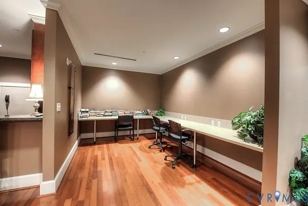 a room with wooden floor and furniture