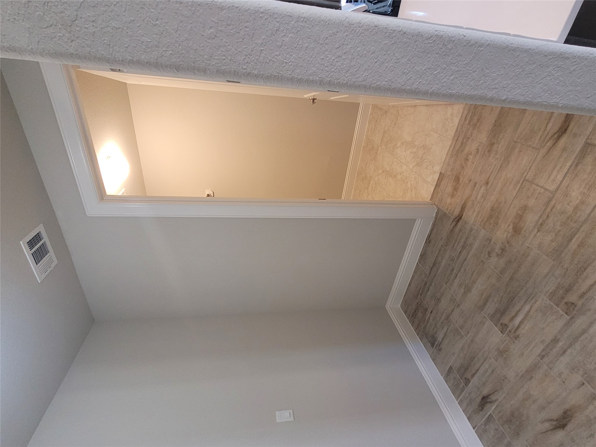 120 Free Stone Drive Georgetown, TX 78628 - Photo 10 of 40 Textured plank flooring extends into a well-lit closet with ample storage space.