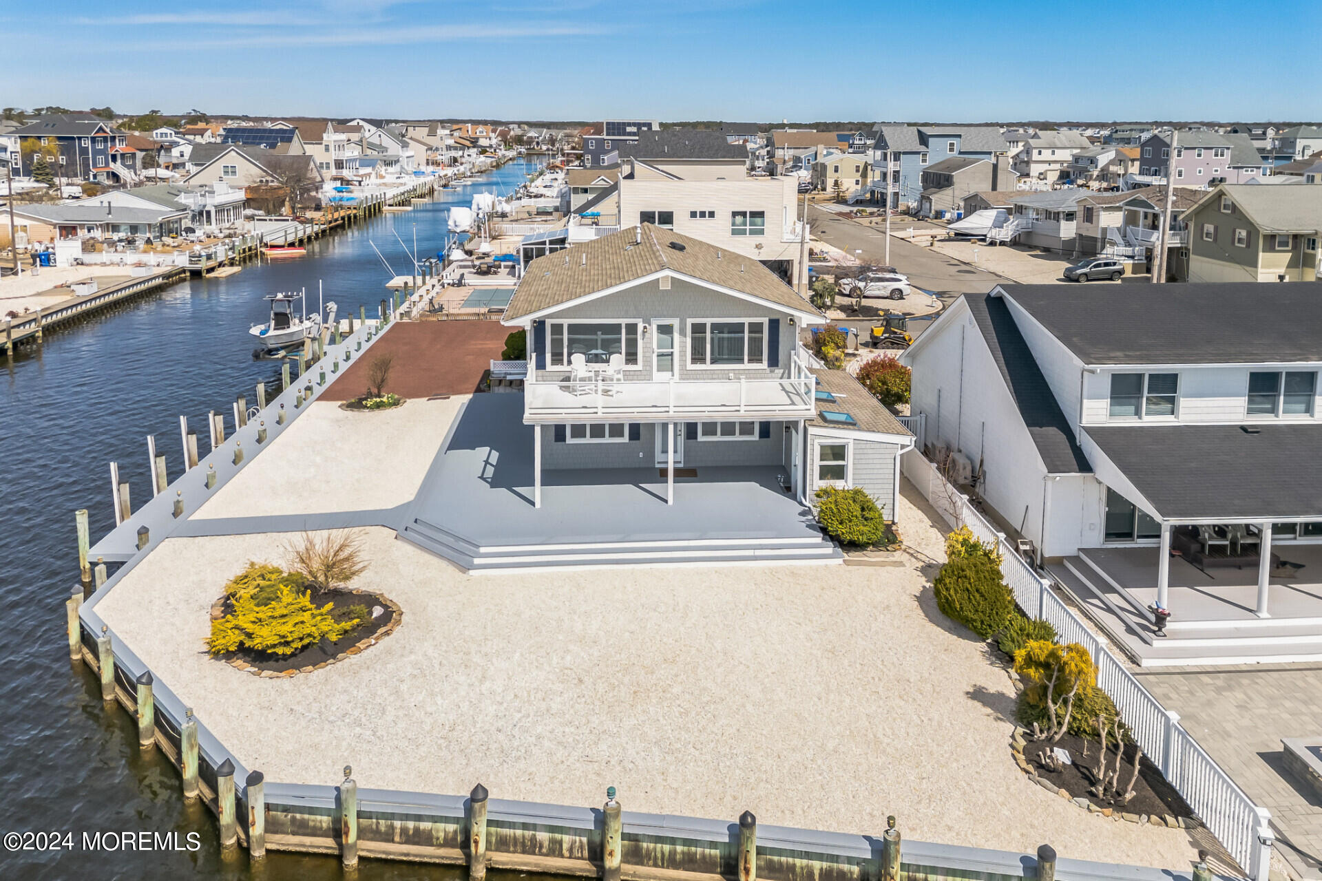 an aerial view of a house with a ocean view