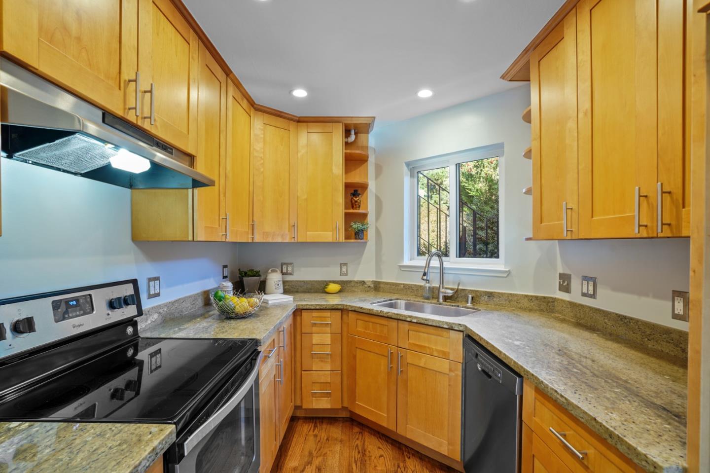 207 Monterey Road, Unit 3 Pacifica, CA 94044 - Photo 13 of 43 a kitchen with a sink a stove and cabinets