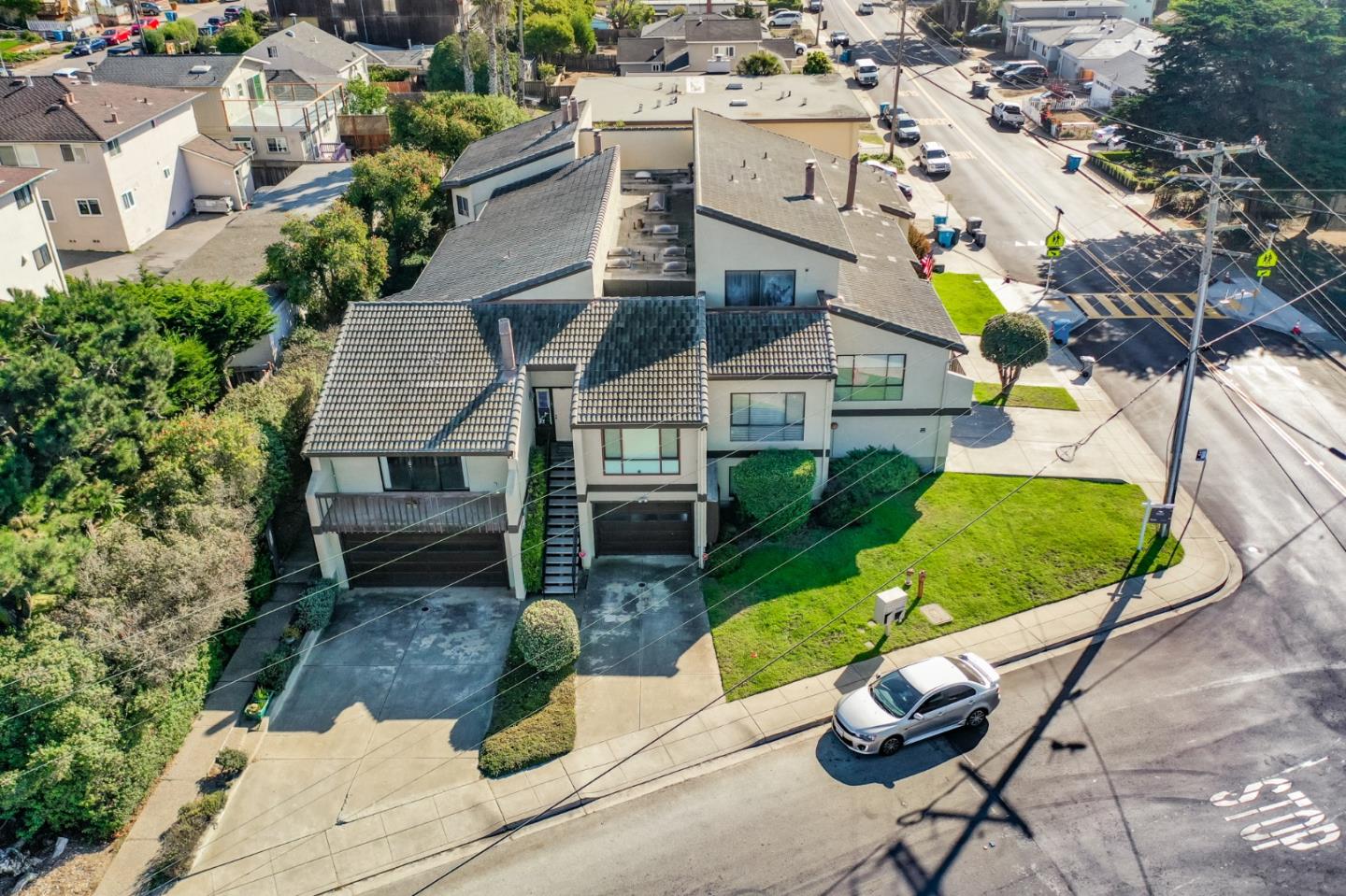 207 Monterey Road, Unit 3 Pacifica, CA 94044 - Photo 3 of 43 an aerial view of a house with garden space and street view