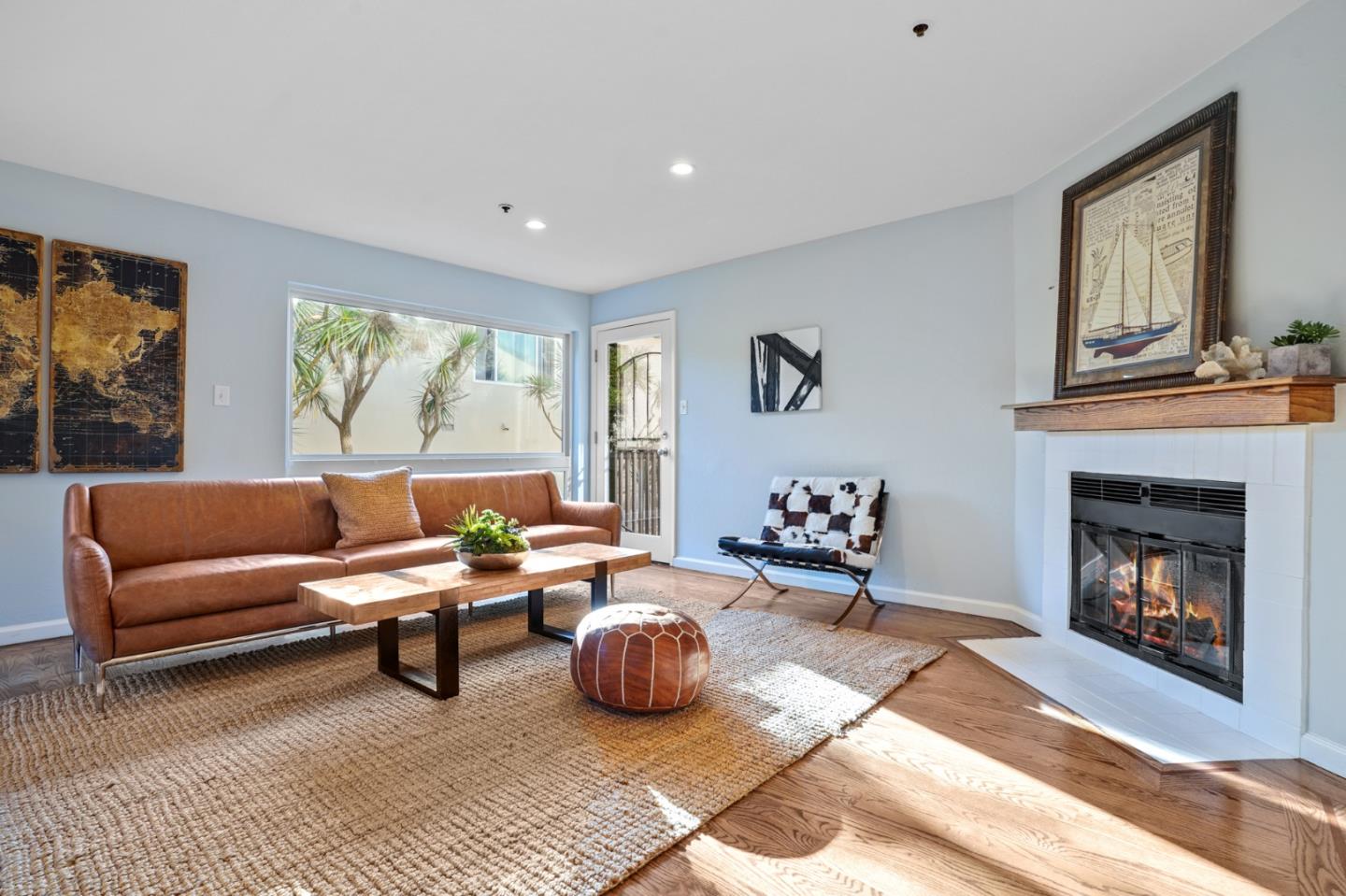 207 Monterey Road, Unit 3 Pacifica, CA 94044 - Photo 9 of 43 a living room with furniture and a fireplace