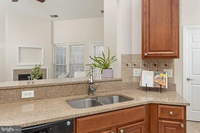 a kitchen with a sink and a window