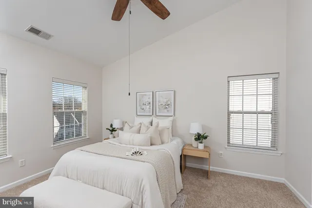 a bedroom with a bed and window