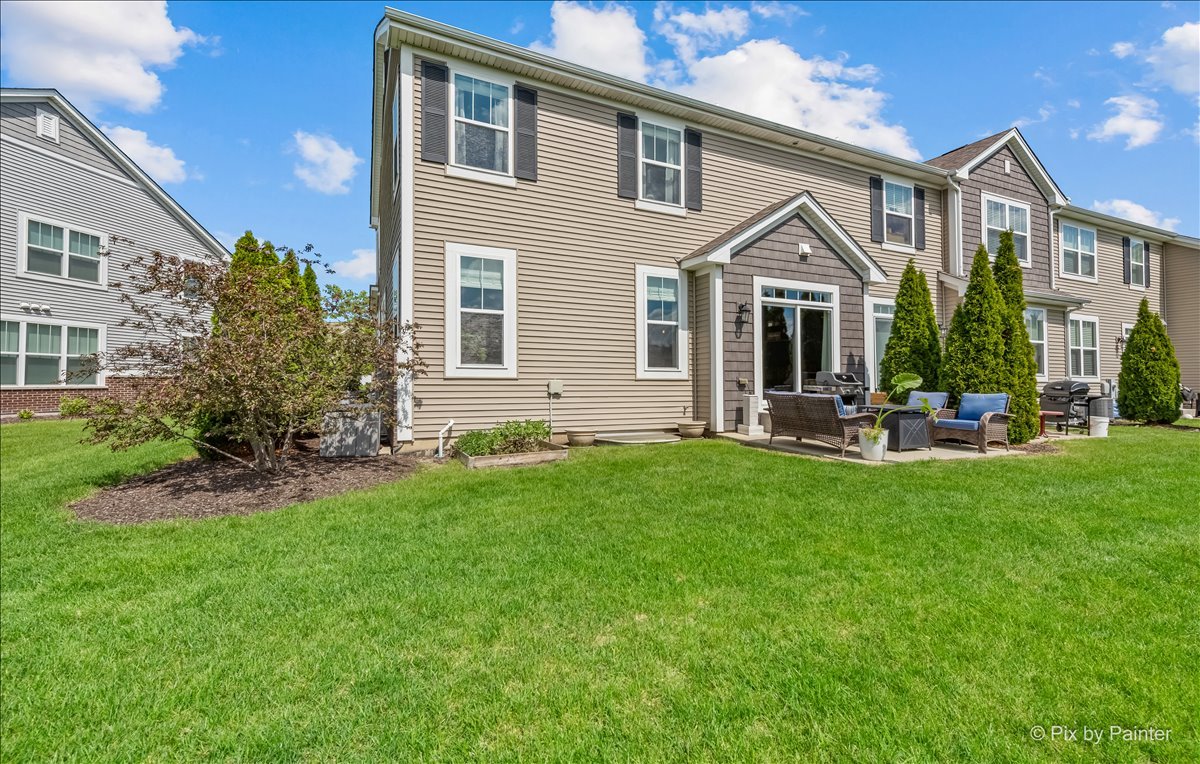 16207 West Switch Grass Road Lockport, IL 60441 - Photo 2 of 45 a front view of a house with a yard and green space