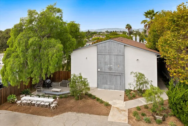 a house view with a outdoor space