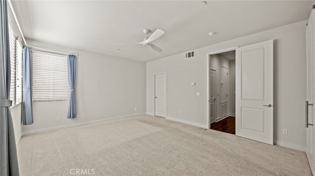 113 Carmine Irvine, CA 92618 - Photo 18 of 43 a view of an empty room with a window