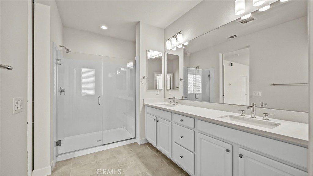 113 Carmine Irvine, CA 92618 - Photo 19 of 43 a bathroom with a double vanity sink mirror and shower