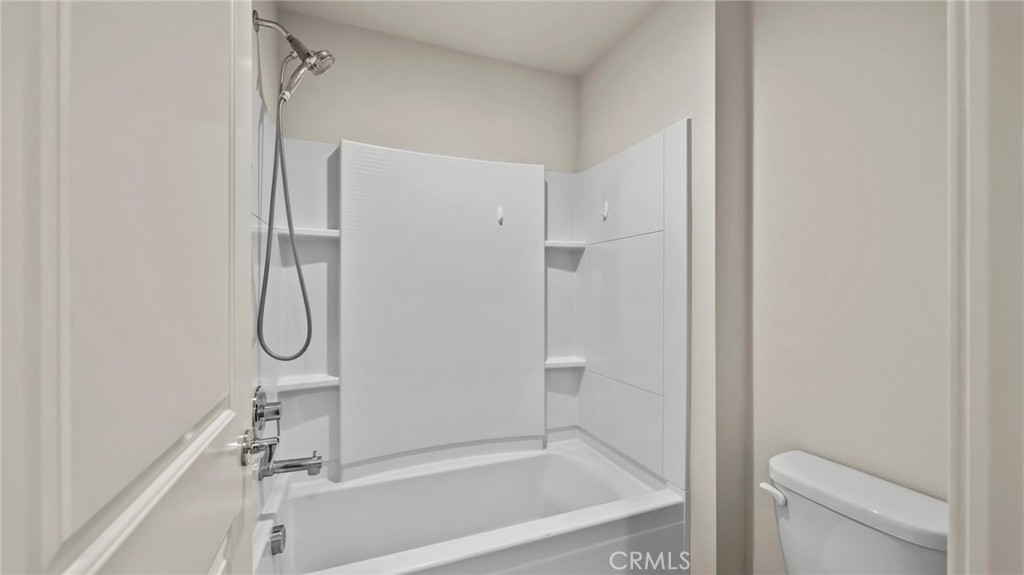 113 Carmine Irvine, CA 92618 - Photo 23 of 43 a bathroom with a glass shower door