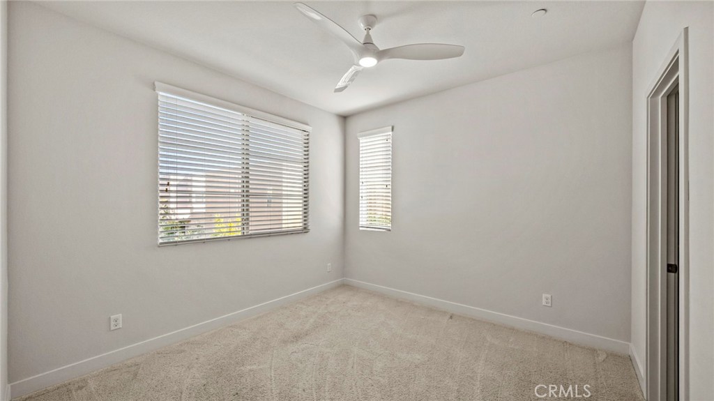 113 Carmine Irvine, CA 92618 - Photo 24 of 43 an empty room with windows and fan