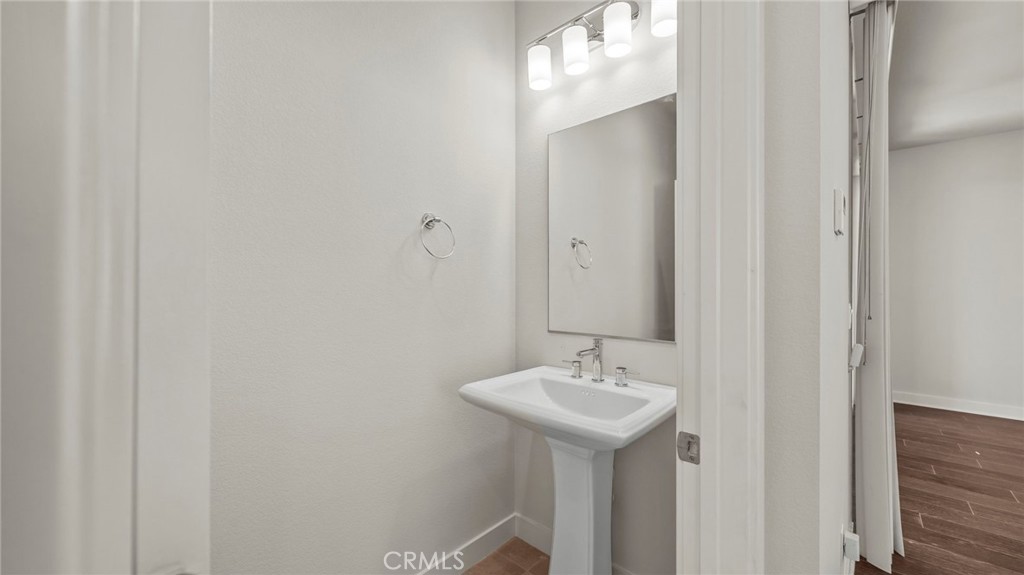 113 Carmine Irvine, CA 92618 - Photo 30 of 43 a bathroom with a sink and mirror