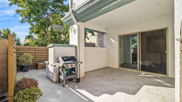 a view of a patio with a table and chairs