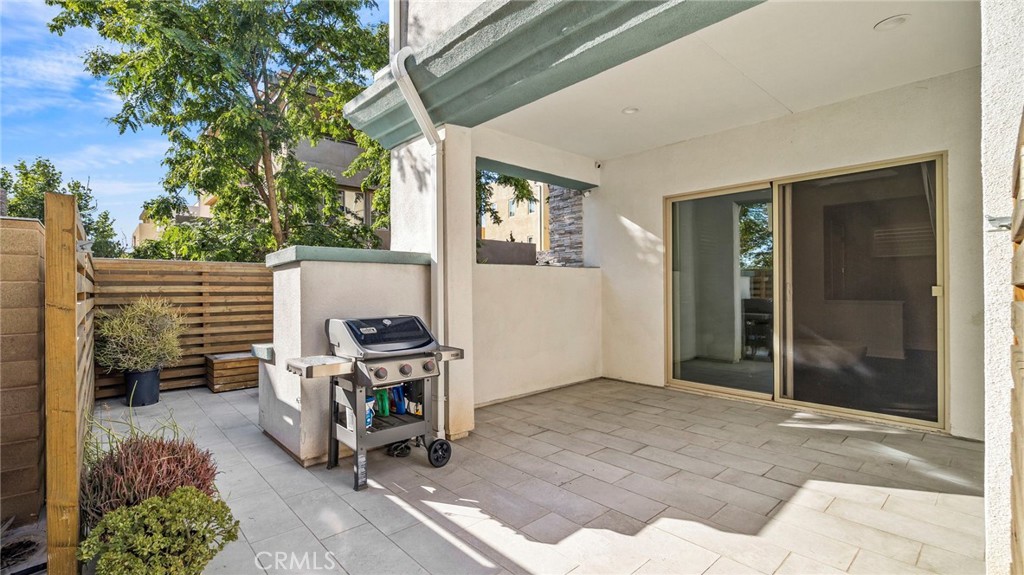 113 Carmine Irvine, CA 92618 - Photo 34 of 43 a view of a patio with a table and chairs
