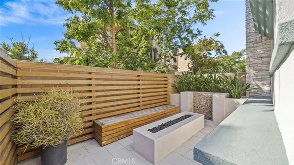 a view of a bench in the backyard