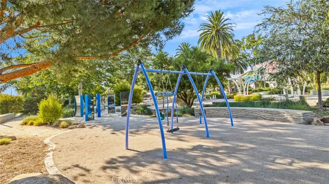 a view of a park with swings and slides