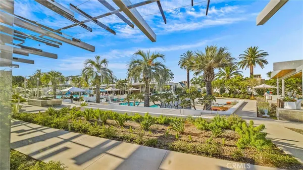 a view of a swimming pool with an outdoor seating