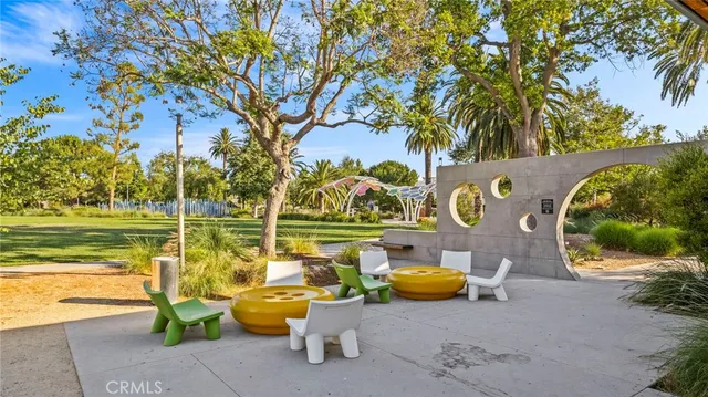 a view of a lake with a lounge chairs