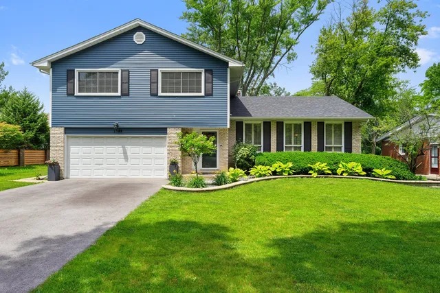 a front view of a house with a yard and porch