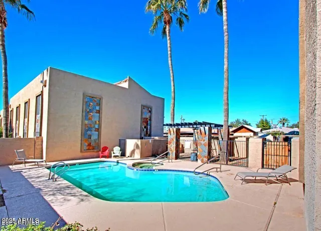 a view of a swimming pool with a patio