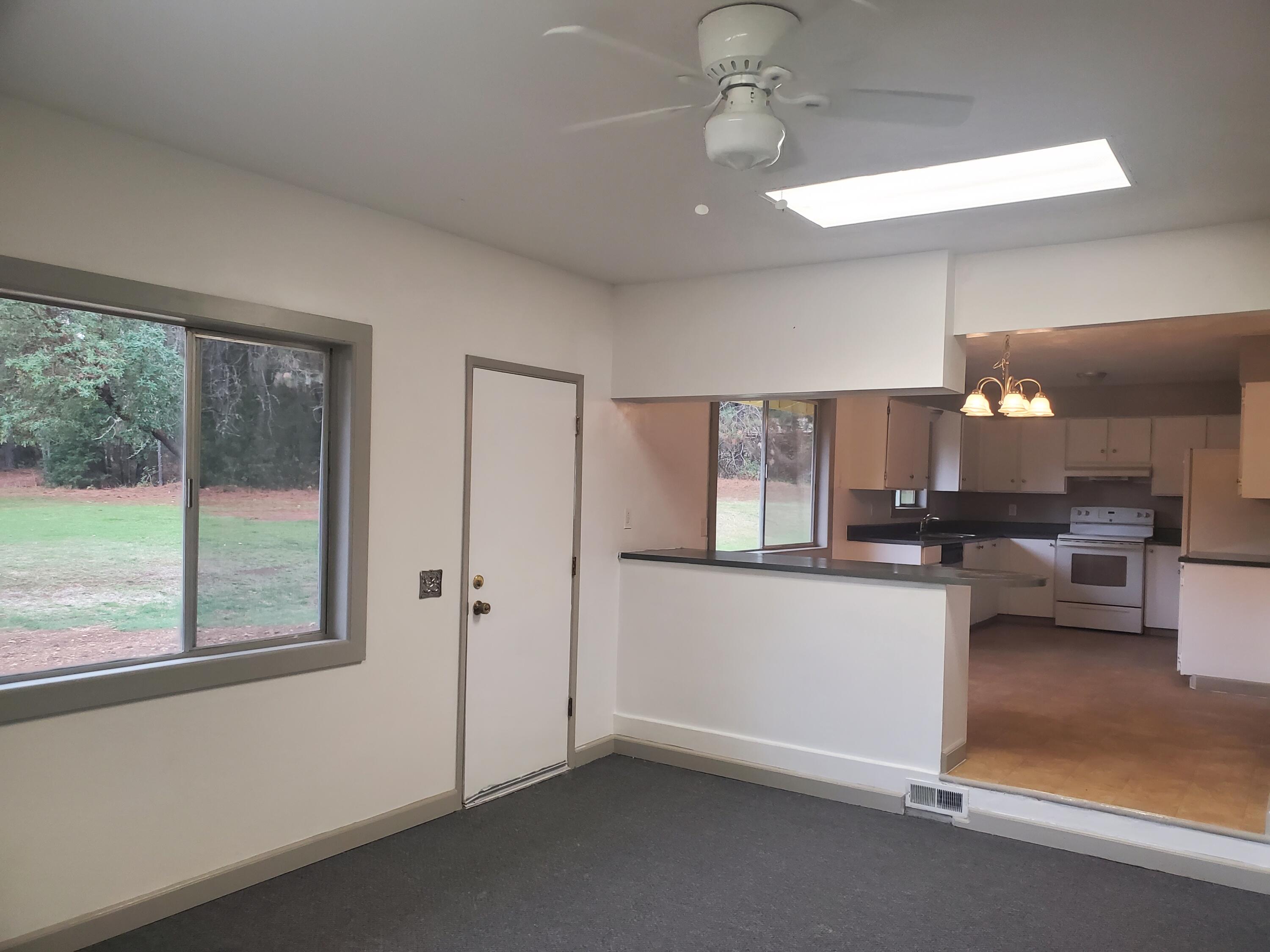513 Queens Branch Road Rogue River, OR 97537 - Photo 4 of 56 a living room with furniture and a large window