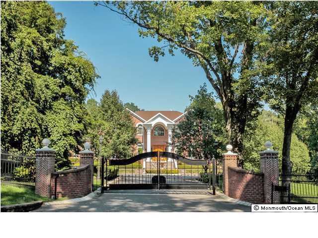 34 Line Road Holmdel, NJ 07733 - Photo 1 of 25 a front view of a house with a yard