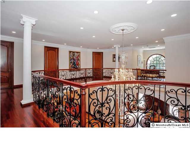 34 Line Road Holmdel, NJ 07733 - Photo 13 of 25 a kitchen with stainless steel appliances granite countertop a sink and a refrigerator