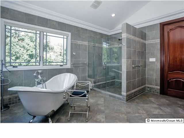 34 Line Road Holmdel, NJ 07733 - Photo 17 of 25 a spacious bathroom with a bathtub and shower