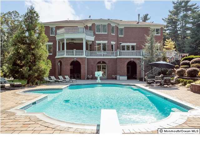 34 Line Road Holmdel, NJ 07733 - Photo 23 of 25 a front view of multiple houses with yard