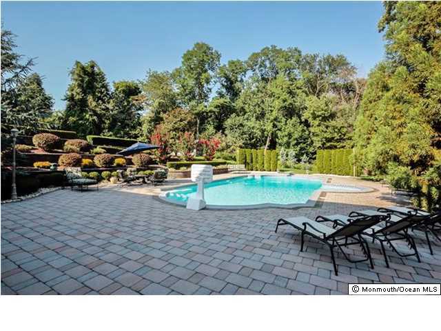 34 Line Road Holmdel, NJ 07733 - Photo 24 of 25 a backyard of a house with table and chairs