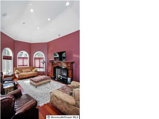 34 Line Road Holmdel, NJ 07733 - Photo 7 of 25 a living room with furniture and fireplace