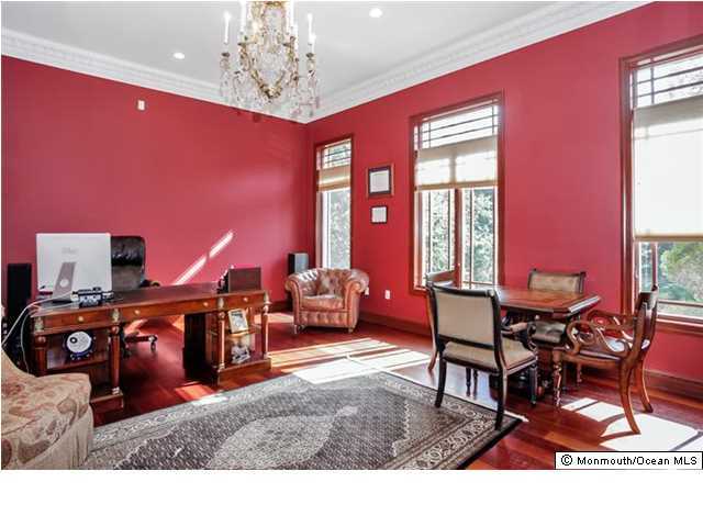 34 Line Road Holmdel, NJ 07733 - Photo 8 of 25 a living room with furniture a dining table and a chandelier