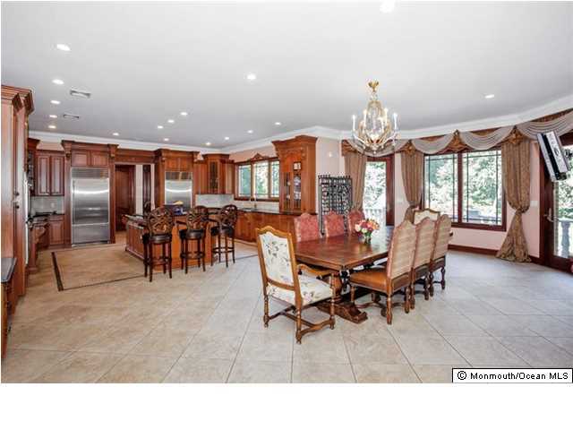 34 Line Road Holmdel, NJ 07733 - Photo 9 of 25 a view of a dining room with furniture and chandelier