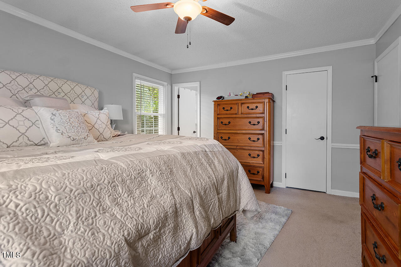 1660 Benson Road Angier, NC 27501 - Photo 20 of 32 The primary suite offers a special place for rest and relaxation.