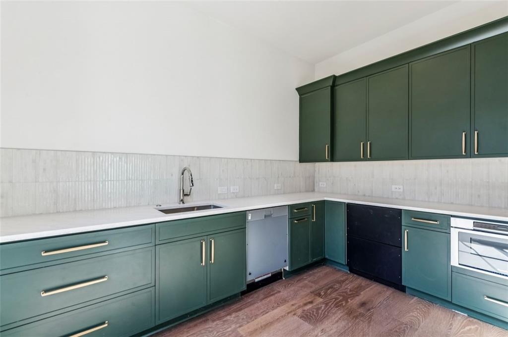 200 River Valley Court Northwest Atlanta, GA 30328 - Photo 16 of 25 a kitchen with a sink and cabinets
