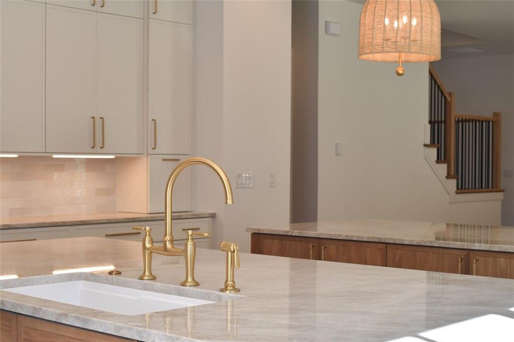 200 River Valley Court Northwest Atlanta, GA 30328 - Photo 5 of 25 a close view of a sink and dishwasher with wooden floor