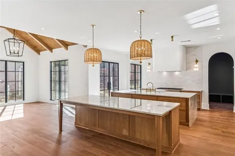 a large bathroom with a large tub and sink