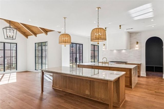 a large bathroom with a large tub and sink