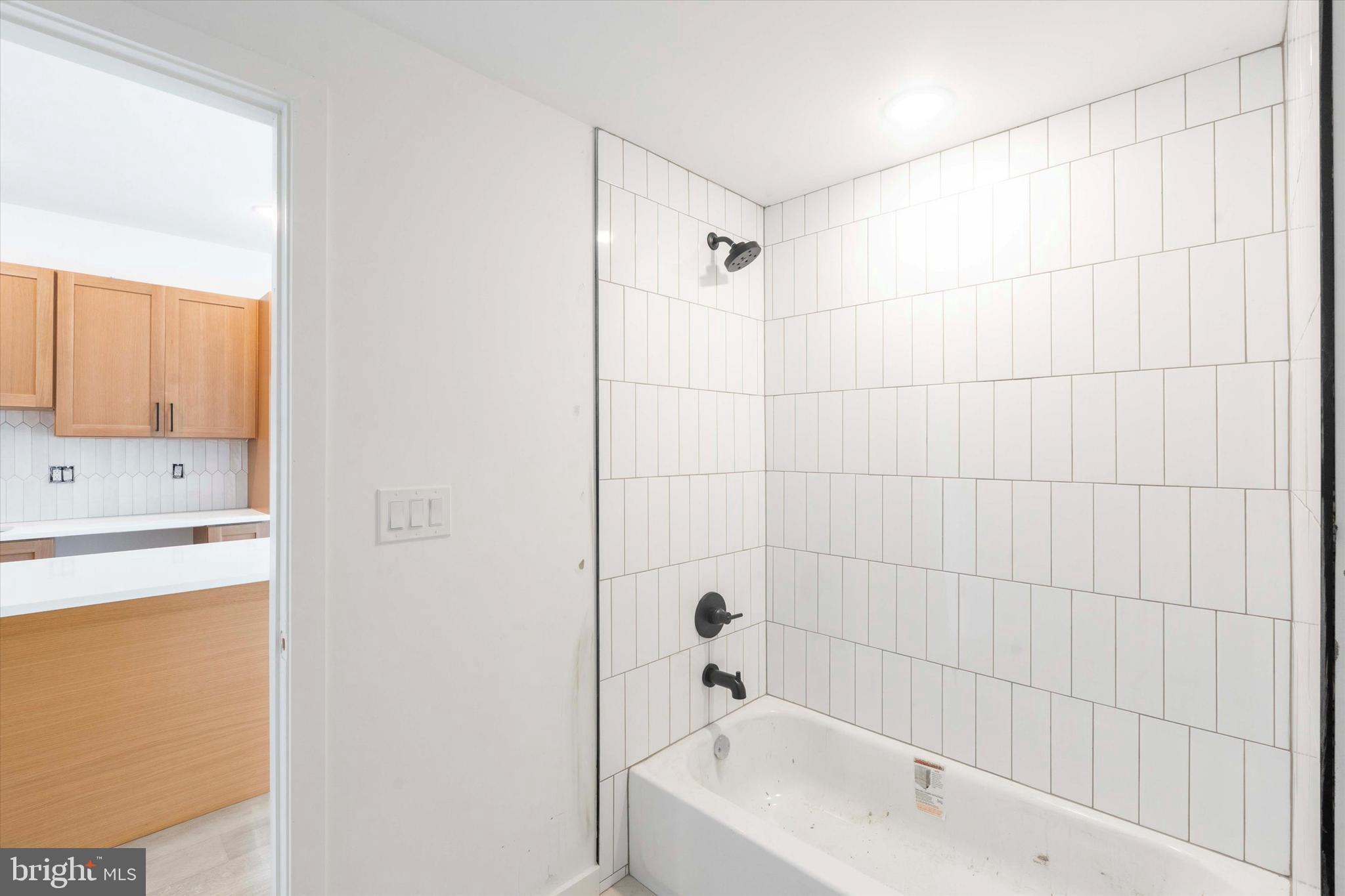 754 South 4th Street, Unit 305 Philadelphia, PA 19147 - Photo 9 of 13 a bathroom with a bathtub and a sink