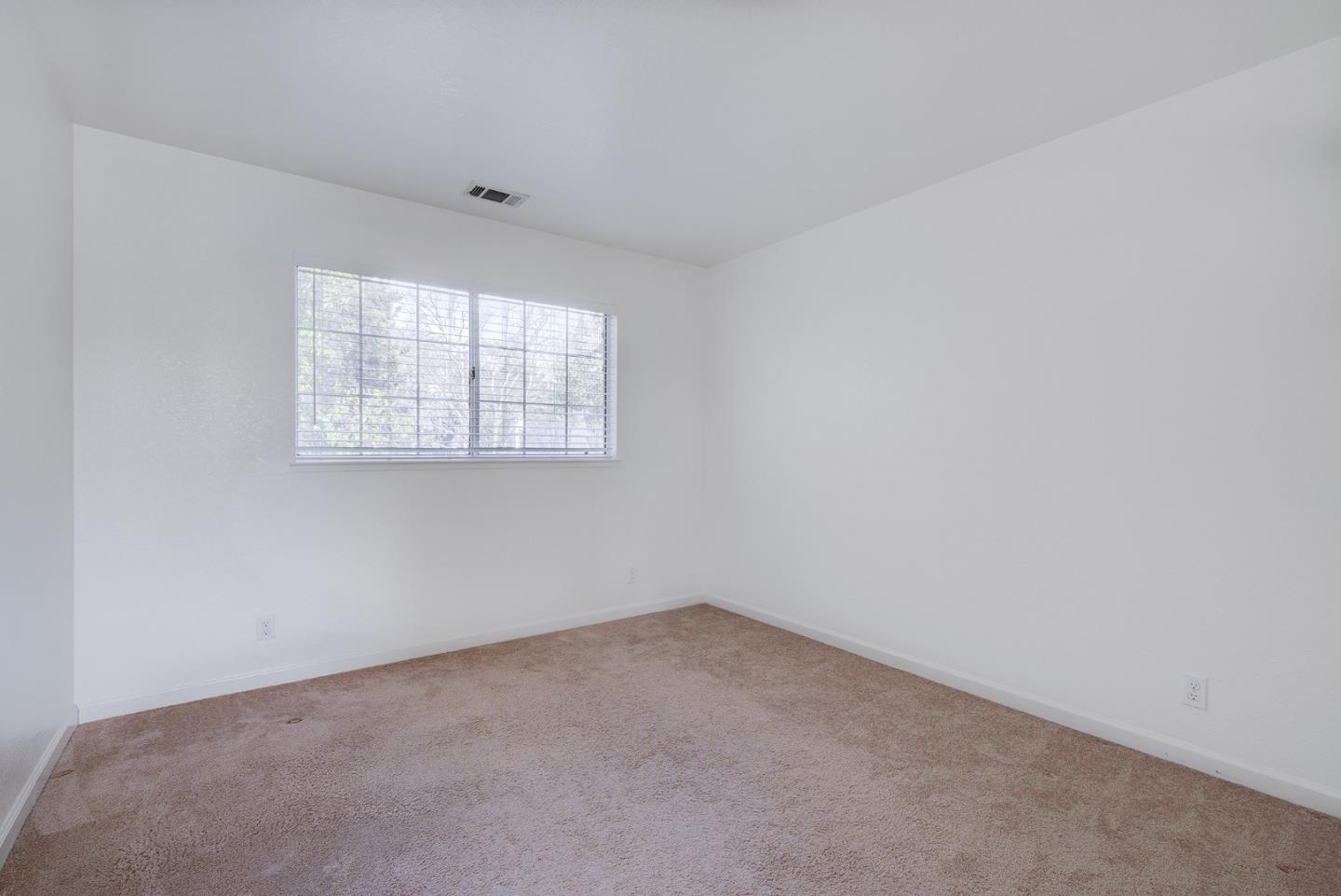 1013 Woodside Road Redwood City, CA 94061 - Photo 12 of 20 an empty room with a window