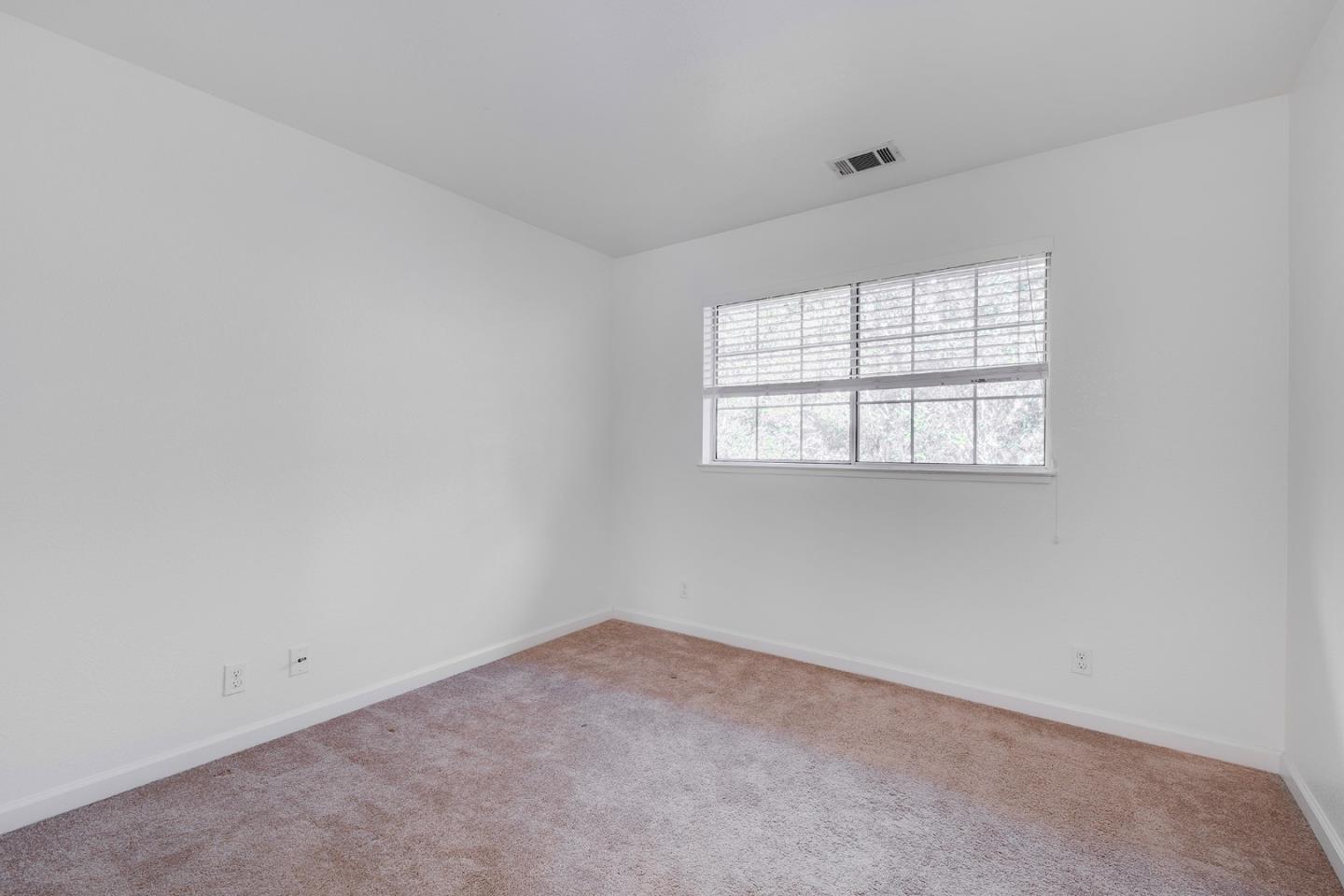 1013 Woodside Road Redwood City, CA 94061 - Photo 13 of 20 an empty room with a window