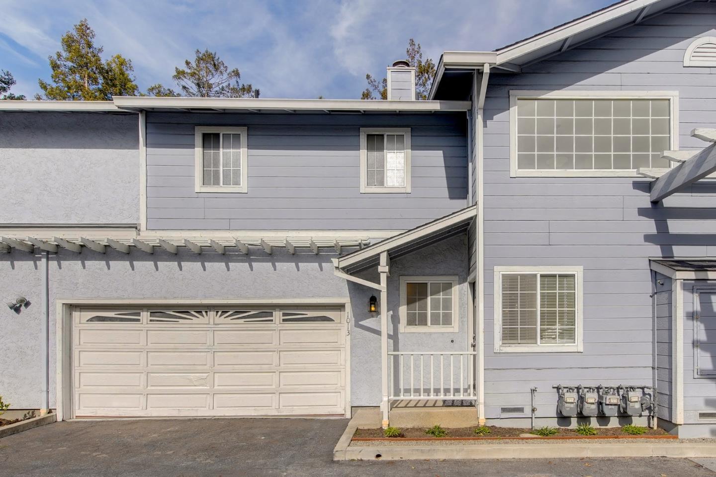 1013 Woodside Road Redwood City, CA 94061 - Photo 20 of 20 a front view of a house with a tree