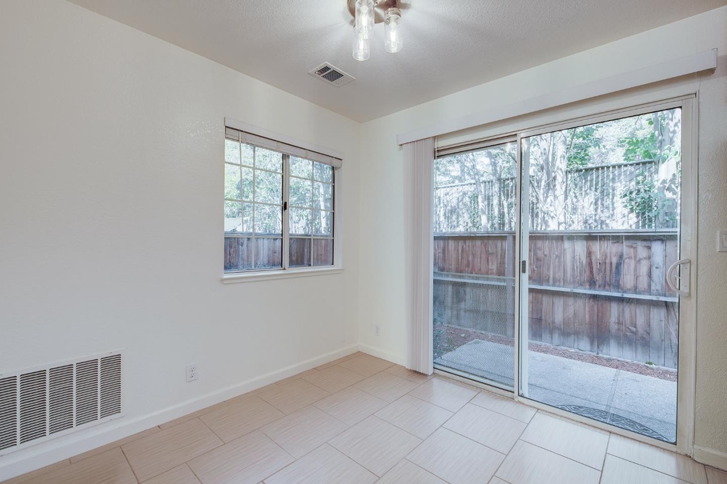 1013 Woodside Road Redwood City, CA 94061 - Photo 8 of 20 a view of an empty room with a window