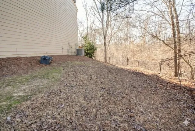 a view of a backyard of the house