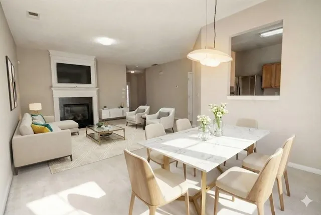 a view of a a dining room with furniture window and wooden floor