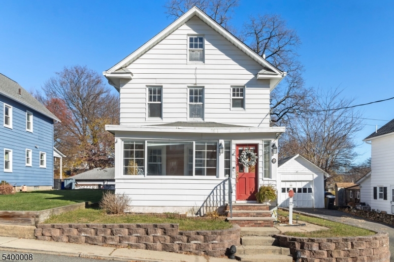 22 Mott Place Rockaway, NJ 07866 - Photo 3 of 42 a front view of a house with a yard